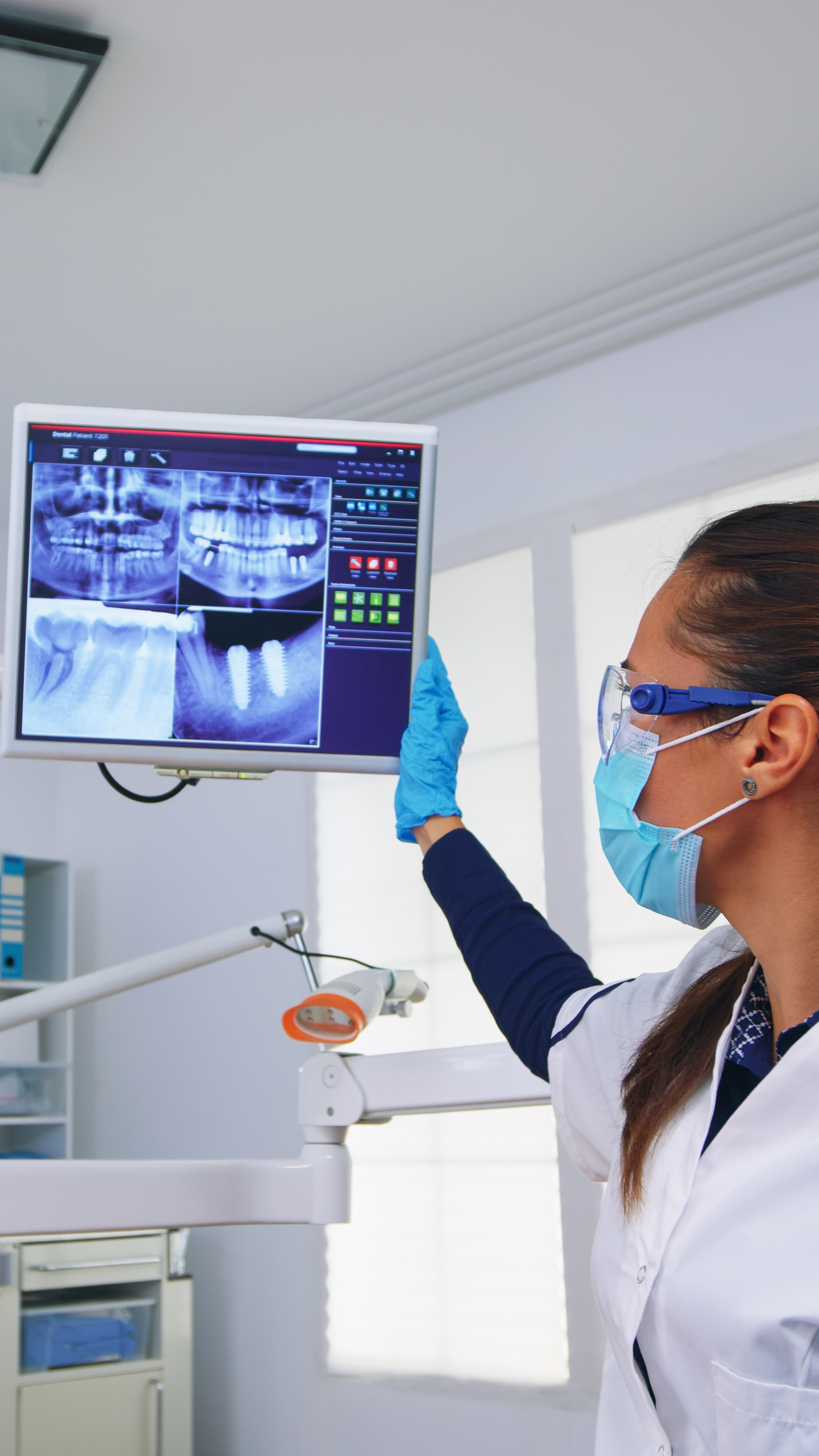 dentist doctor patient looking digital teeh x ray dental office person pov stomatology wearing protective face mask gloves pointing teeth radiography stomatological clinic